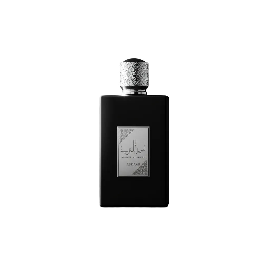 Black perfume bottle with silver cap on a white background