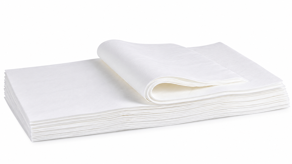 A stack of white cotton bed sheets with one sheet folded over, displayed on a clean white background.