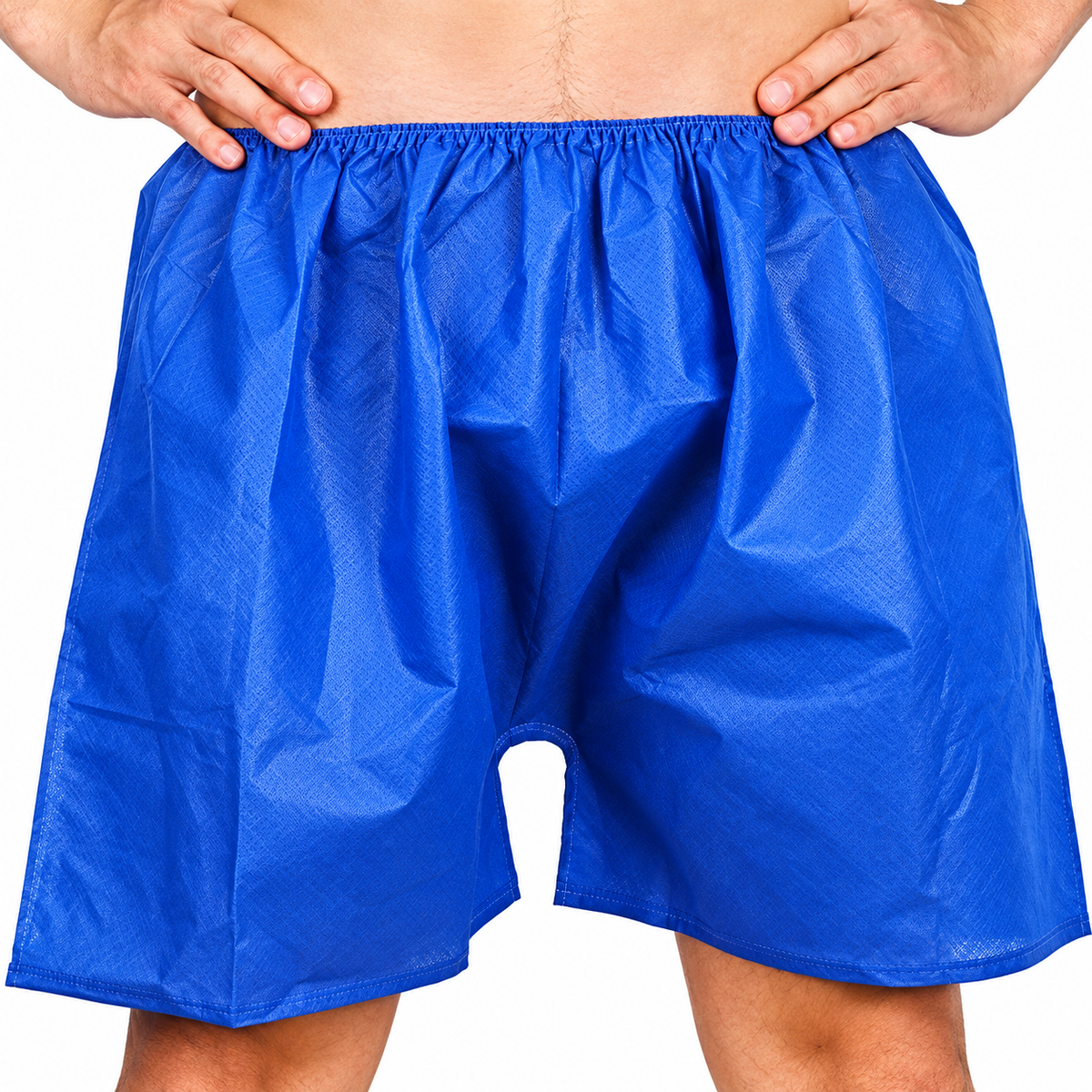 Blue disposable plastic undergarment-style shorts worn by a model, shown from the waist to upper thighs against a plain white background.