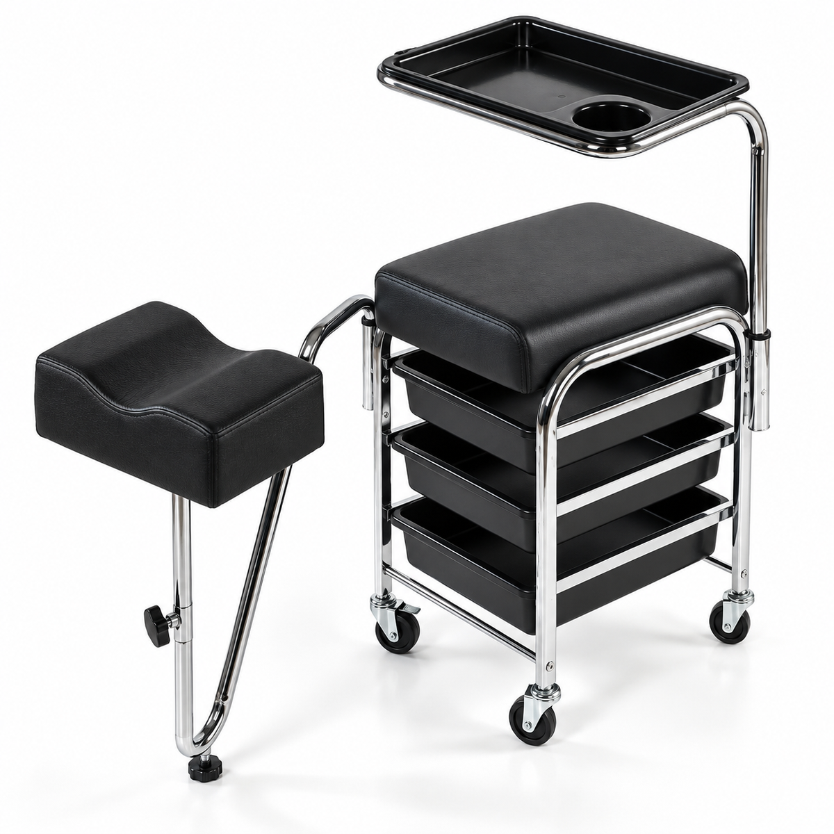 Black padded salon or spa treatment table with an attached matching footrest, three storage trays, and a chrome metal frame on casters, shown on a white studio background.