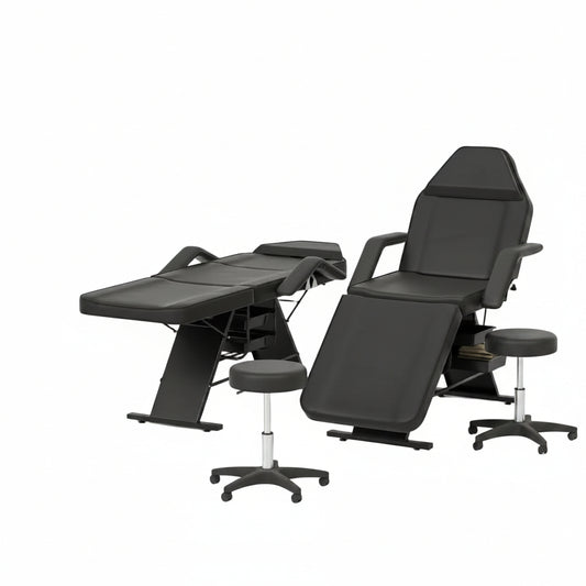 Black massage or tattoo treatment chairs and matching stools arranged in a clean, modern spa or clinic room with light wood floors and beige walls.