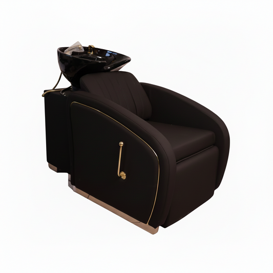 A luxury salon chair with an integrated black shampoo bowl and gold trim details, shown on a solid white background.