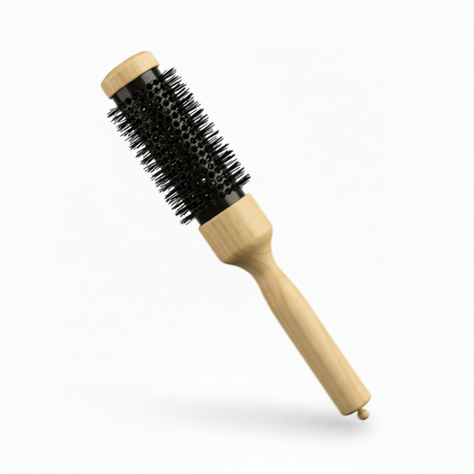 A round hot air brush with a light natural wood handle and end caps, and black bristles, shown diagonally on a clean white background.